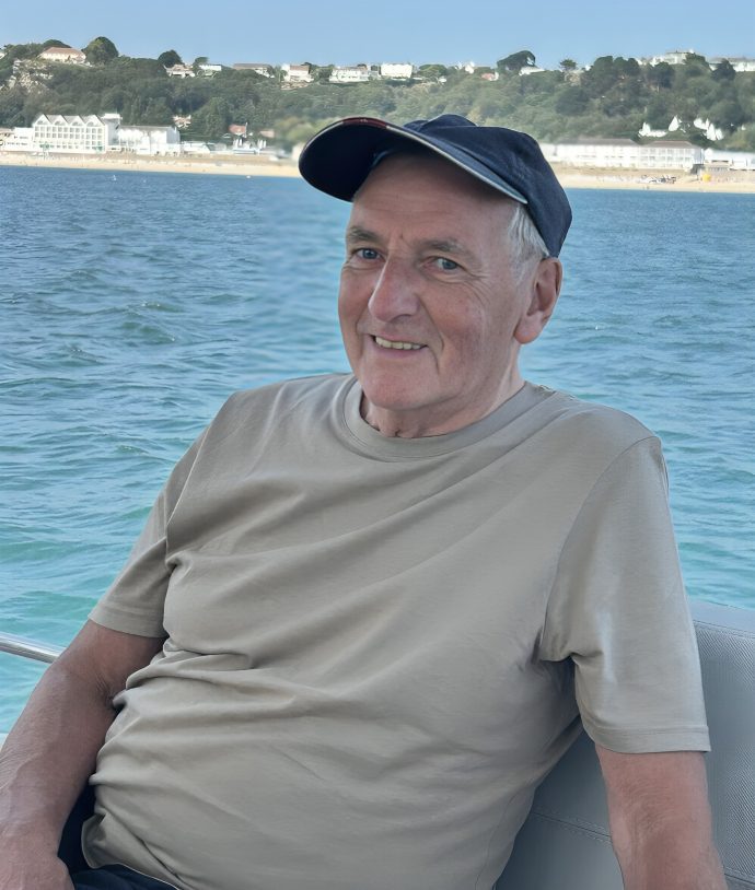 Man relaxing on a boat by water.